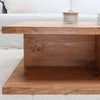 Rustic Wood Cross Base 2-Level Coffee Table in Aged Oak Color in Living Room near Sofa