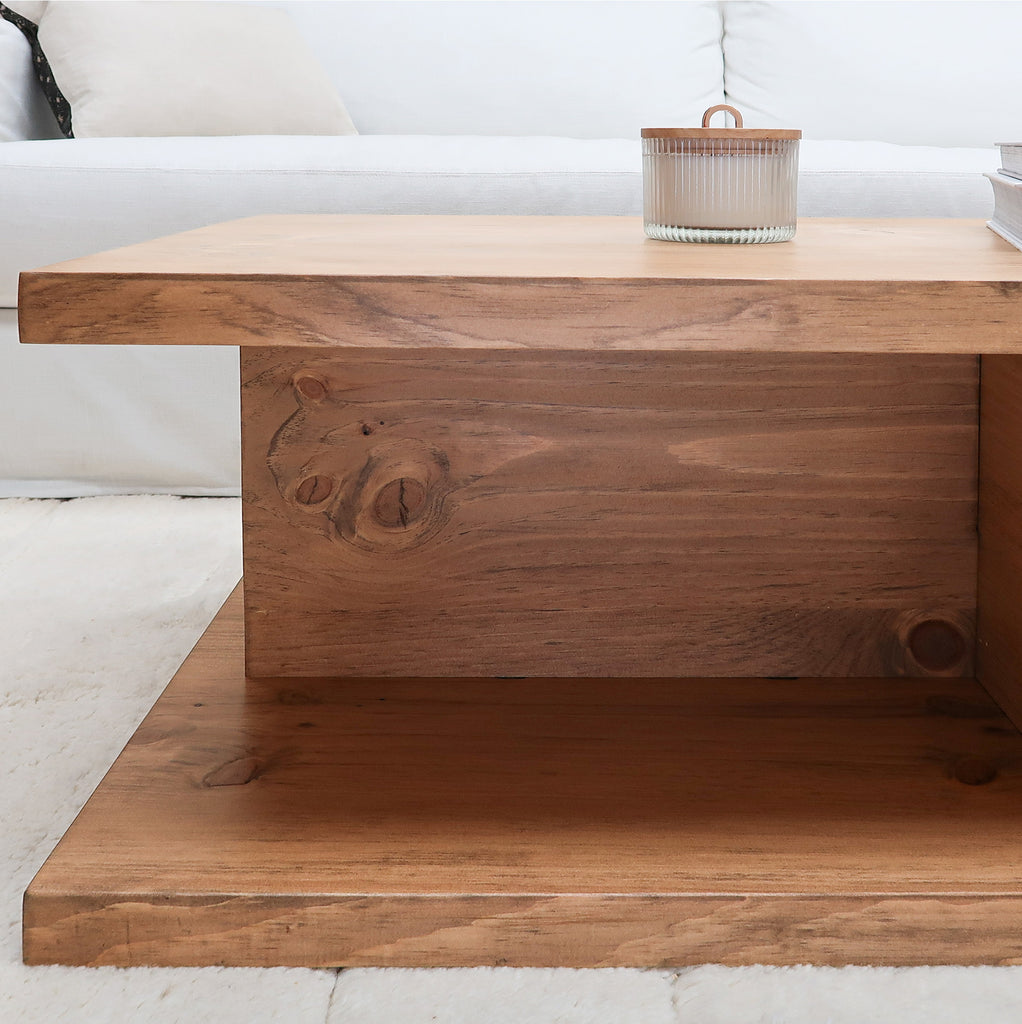 Rustic Wood Cross Base 2-Level Coffee Table in Aged Oak Color in Living Room near Sofa