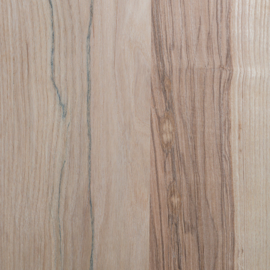 Close-up of a wooden unfinished ash surface with a natural grain pattern