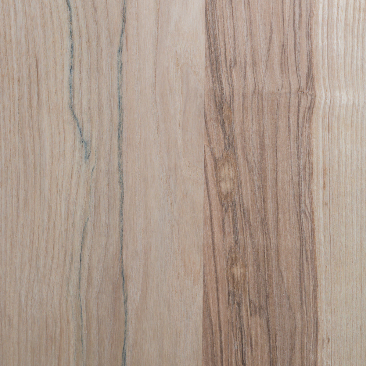 Close-up of a wooden unfinished ash surface with a natural grain pattern