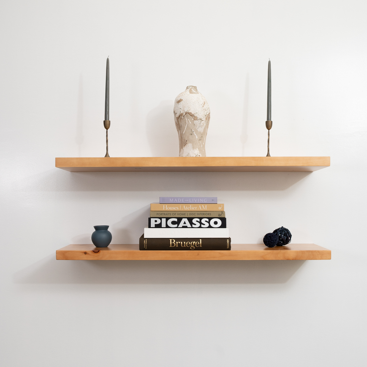 Wooden floating shelves with books