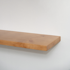 Wooden floating shelf on a white background