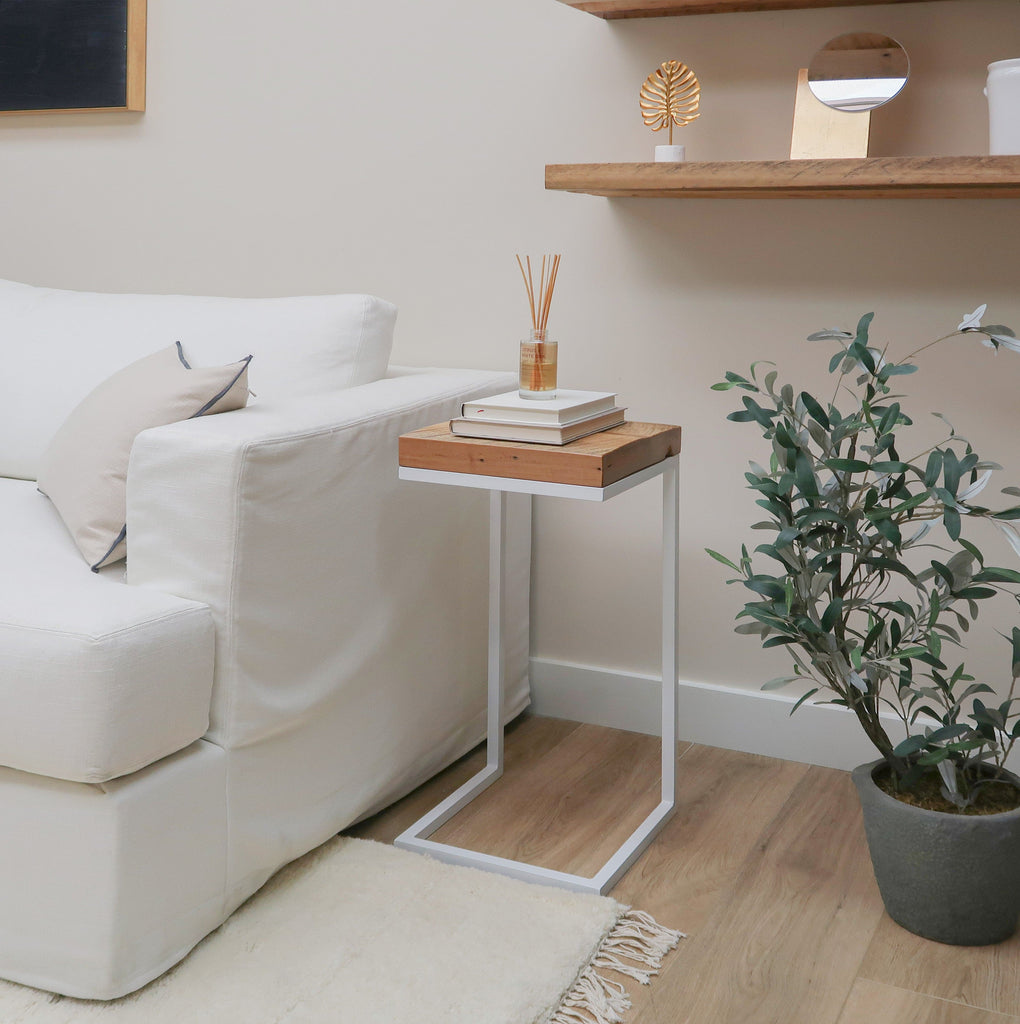 Reclaimed Wood Side Table C-Shape with Metal Base near Sofa in Living Room