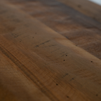 Close-up of a wooden surface with visible grain and texture