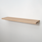 A minimalist floating wooden shelf with a natural light oak finish, mounted on a plain white wall.