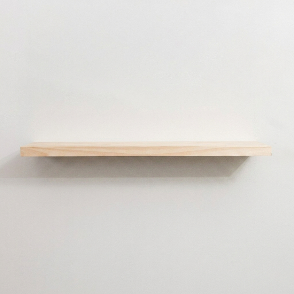 Wooden floating shelf on a plain white wall