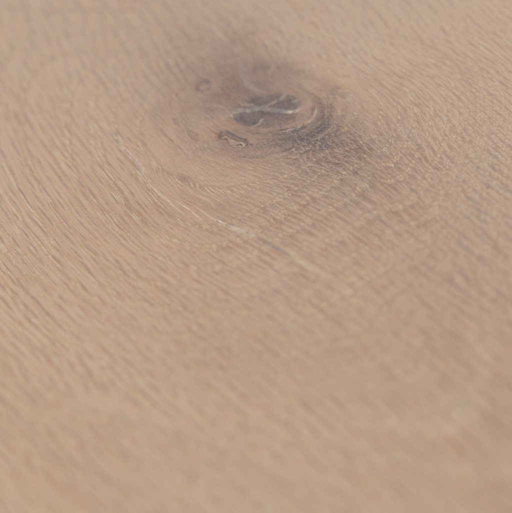 Close-up of a wooden white oak surface with a prominent grain pattern