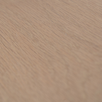 Close-up of a wooden surface with a light brown color and visible grain pattern.