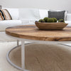 Round Reclaimed Wood Coffee Table with White Metal Base in Living Room