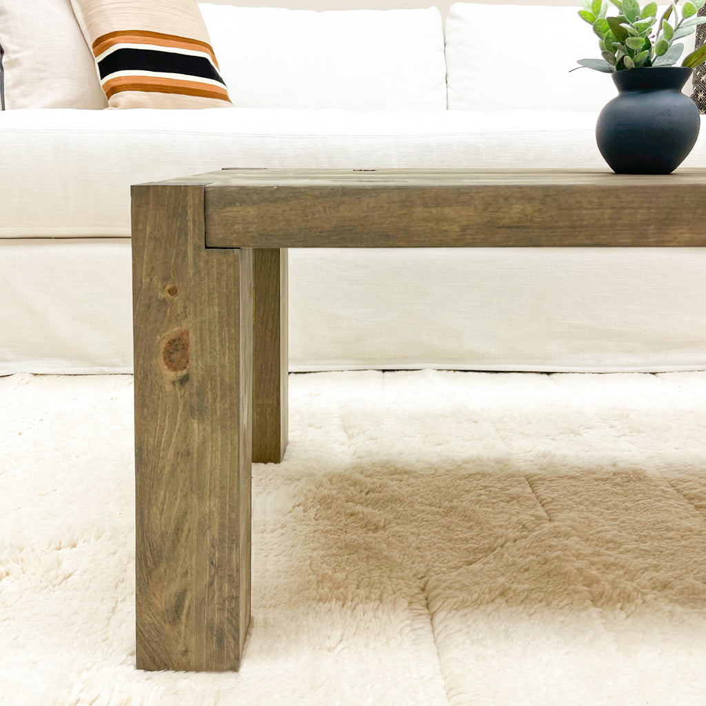 Rustic Wood Coffee Table with Post Legs in Aged Barrel Color Style in Living Room