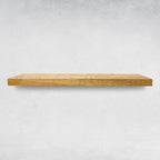 Aged Oak wooden floating shelf on a light background
