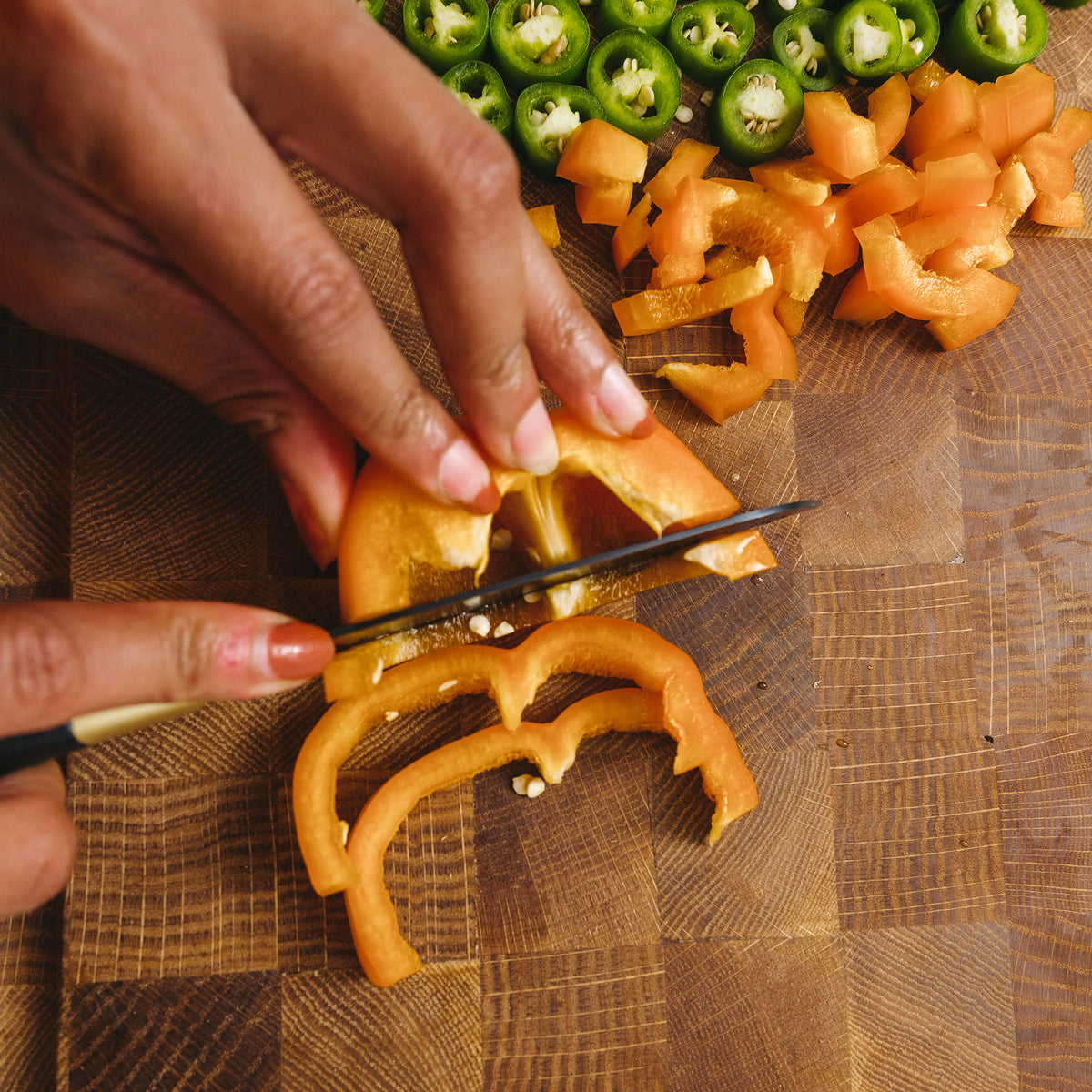 Cutting Pepper on Custom White Oak Wood Cutting Board in Kitchen