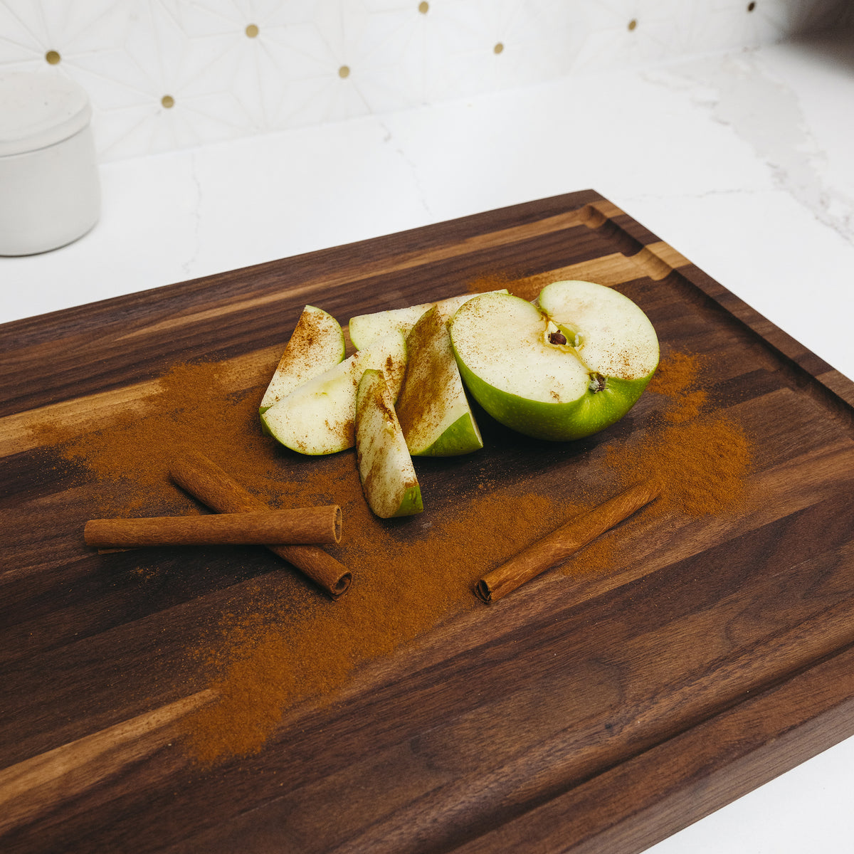 Cooking Apple with Cinnamon on Custom Walnut Wood Cutting Board in Kitchen